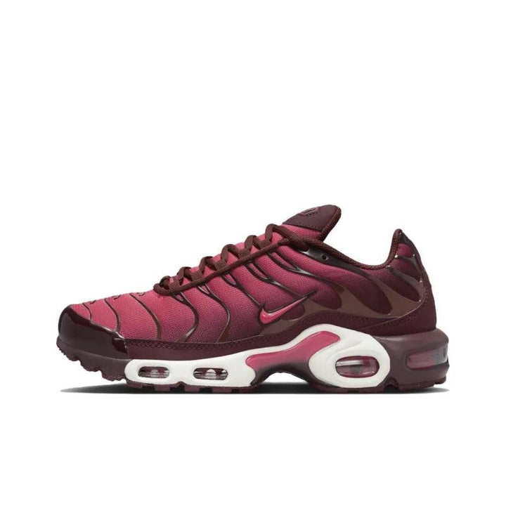 Maroon and burgundy Nike Air Max Plus sneakers with white accents.