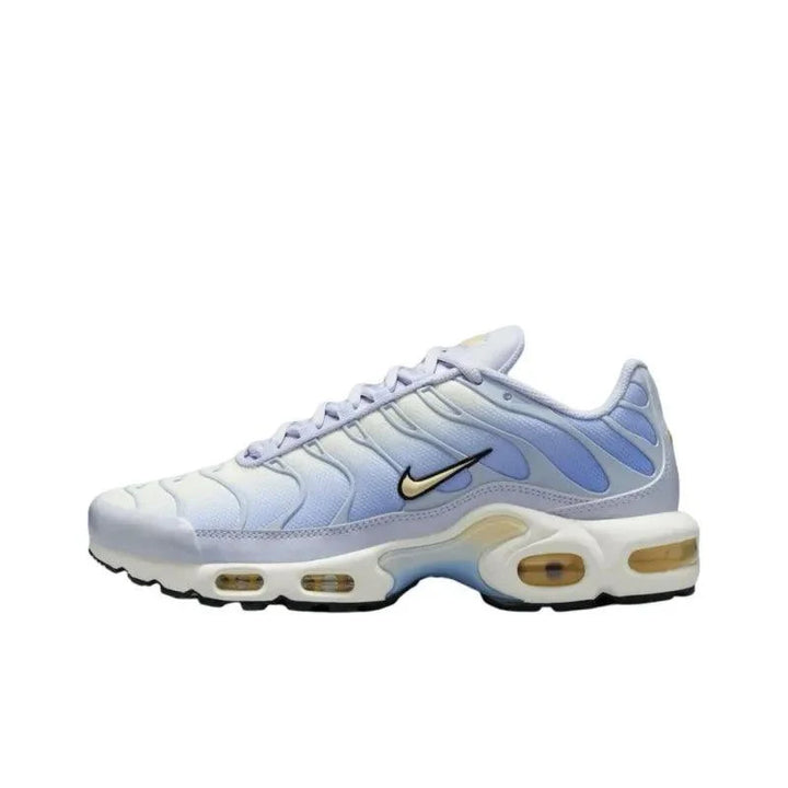 Light blue and lavender gradient Nike Air Max Plus sneakers with gold swoosh logo.