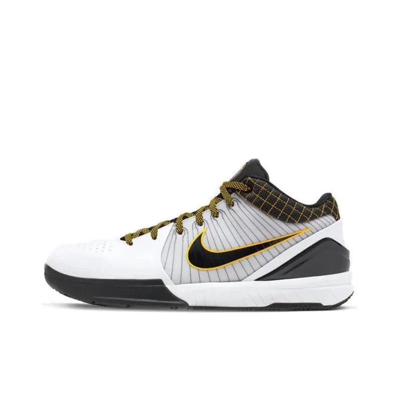 Side view of a white Nike training shoe with black and gold accents.