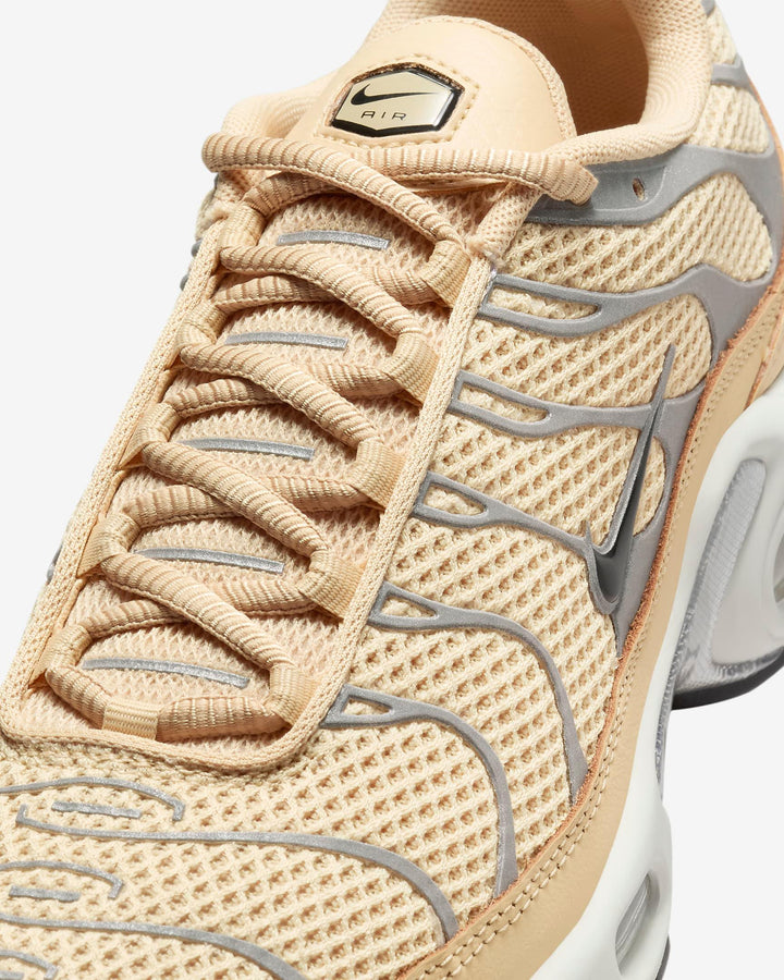 Beige mesh sneakers with tan laces and grey wavy accents.